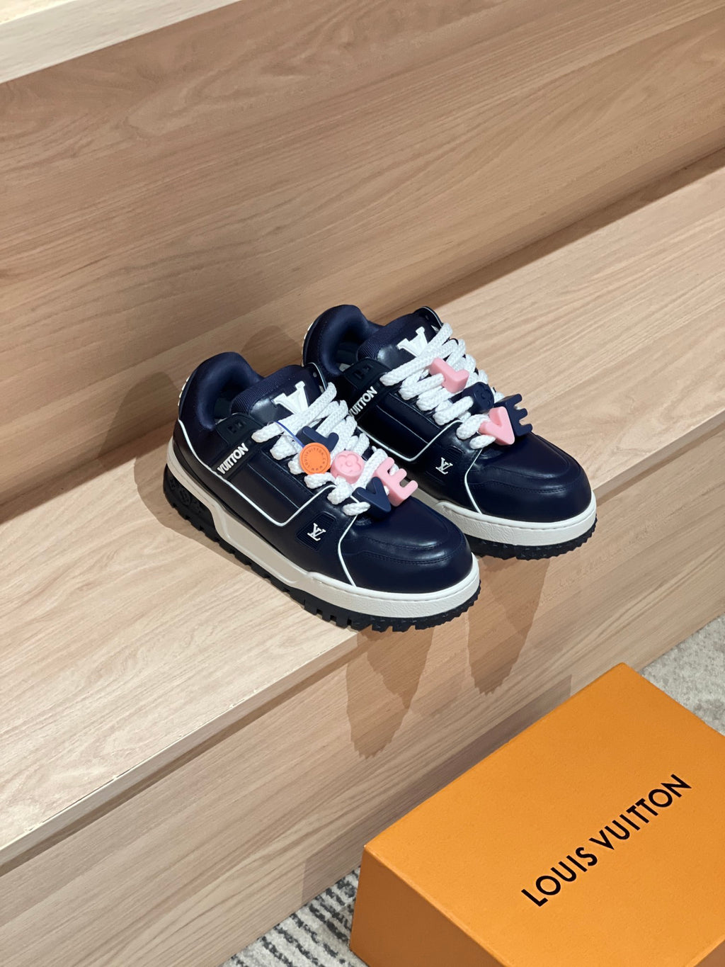 Louis Vuitton navy low-top trainer sneakers with multicolor lace charms