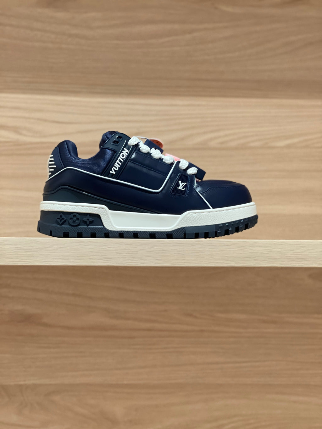 Louis Vuitton navy trainer sneakers with white laces and logo strap detail