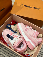 Pink and light-pink sneakers in a shoebox, with lace and decorative straps