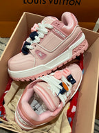 Pink Louis Vuitton low-top sneakers with lace, patch logo, and mint outsole trim