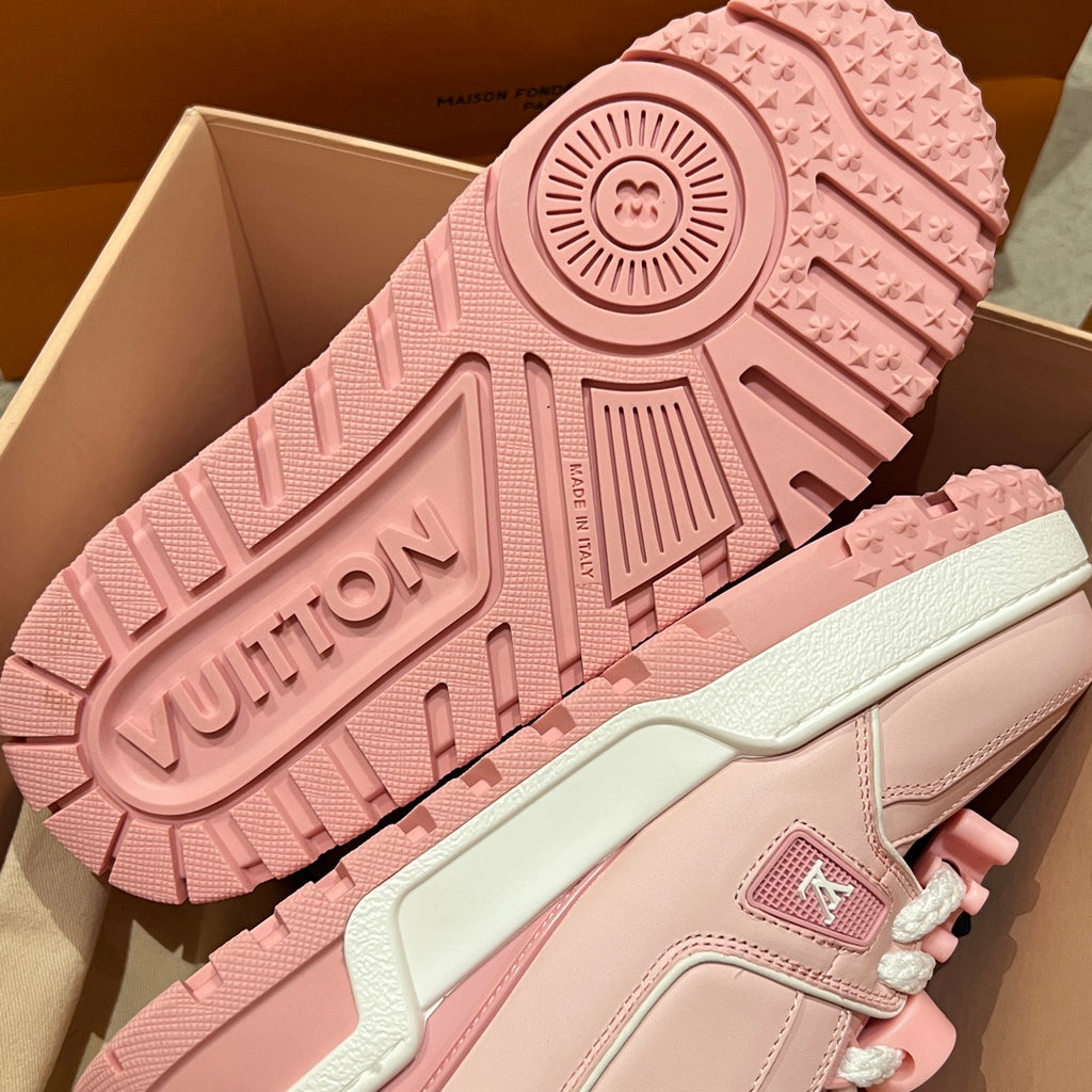 Pink sneaker outsole and heel detail with tread pattern and embossed branding