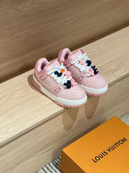 Pair of pink lace-up sneakers with mint accents and chunky white midsole