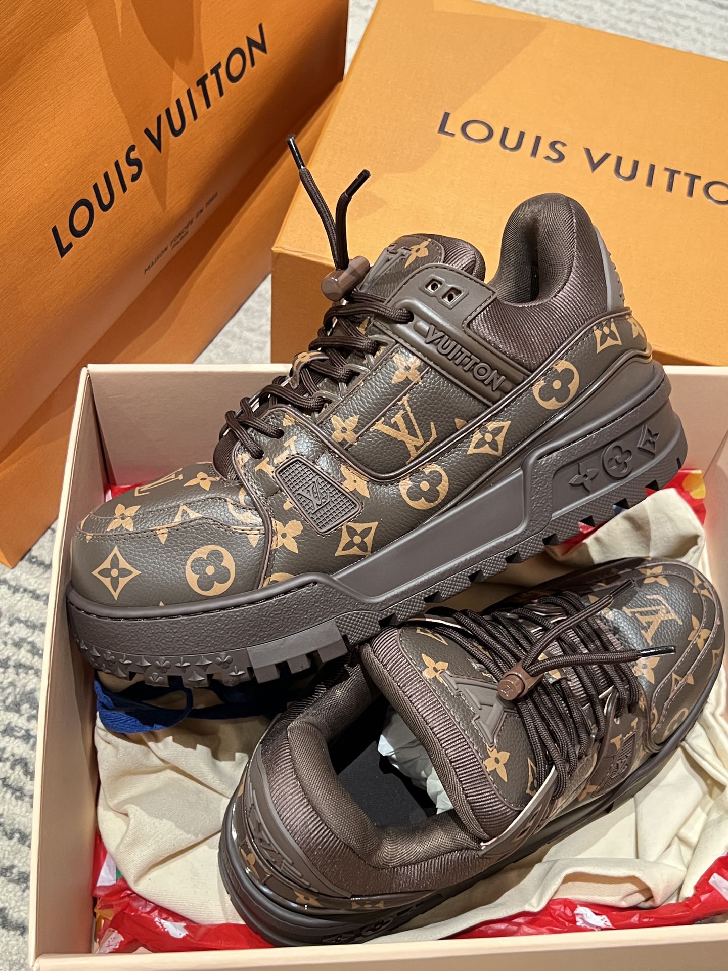 Louis Vuitton monogram trainer shoes in dark brown with black laces, front three-quarter view