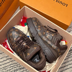 Louis Vuitton monogram trainer shoes with black laces, shown in a shoe box