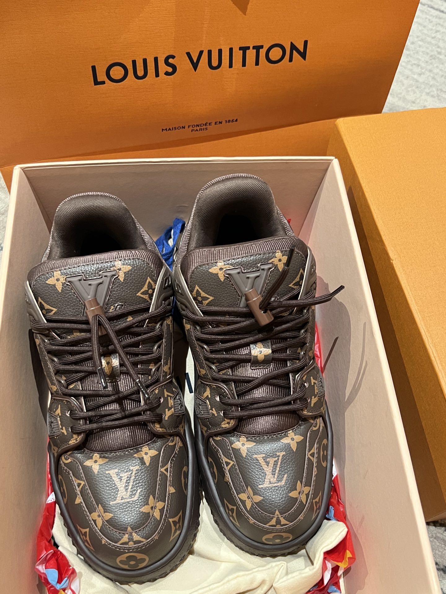 Louis Vuitton monogram trainer shoes with black laces, top view