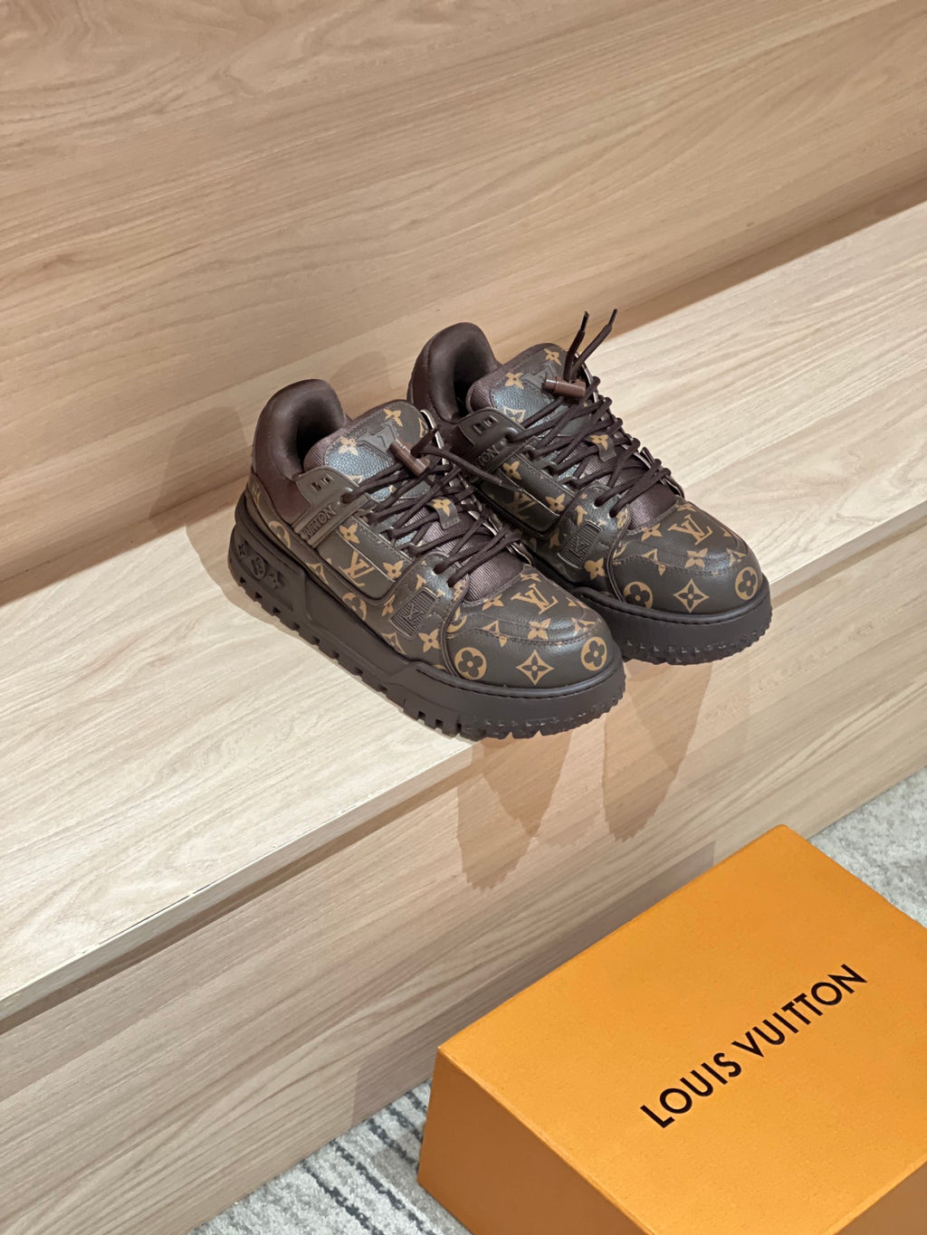 Louis Vuitton monogram trainer shoes in dark brown with black laces, side view