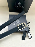 Navy leather belt with gold Greek key buckle and punched eyelets