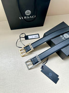 Navy leather belt with gold Greek key buckle and hanging tags