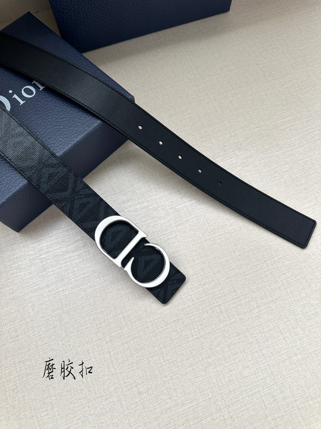 Dark blue Dior belt strap with pin holes and gold-tone CD buckle