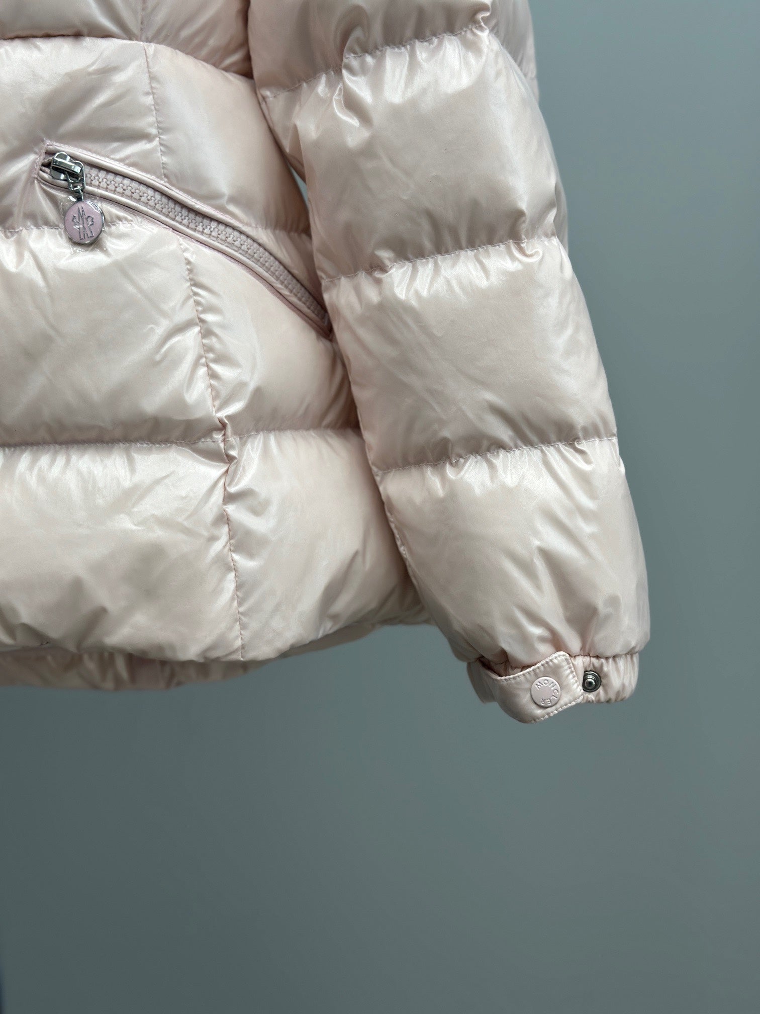 Moncler light pink quilted puffer jacket sleeve and side pocket zipper