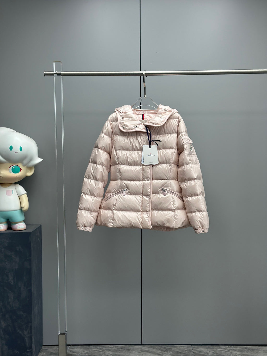 Moncler light pink hooded puffer jacket with front zip and quilted paneling