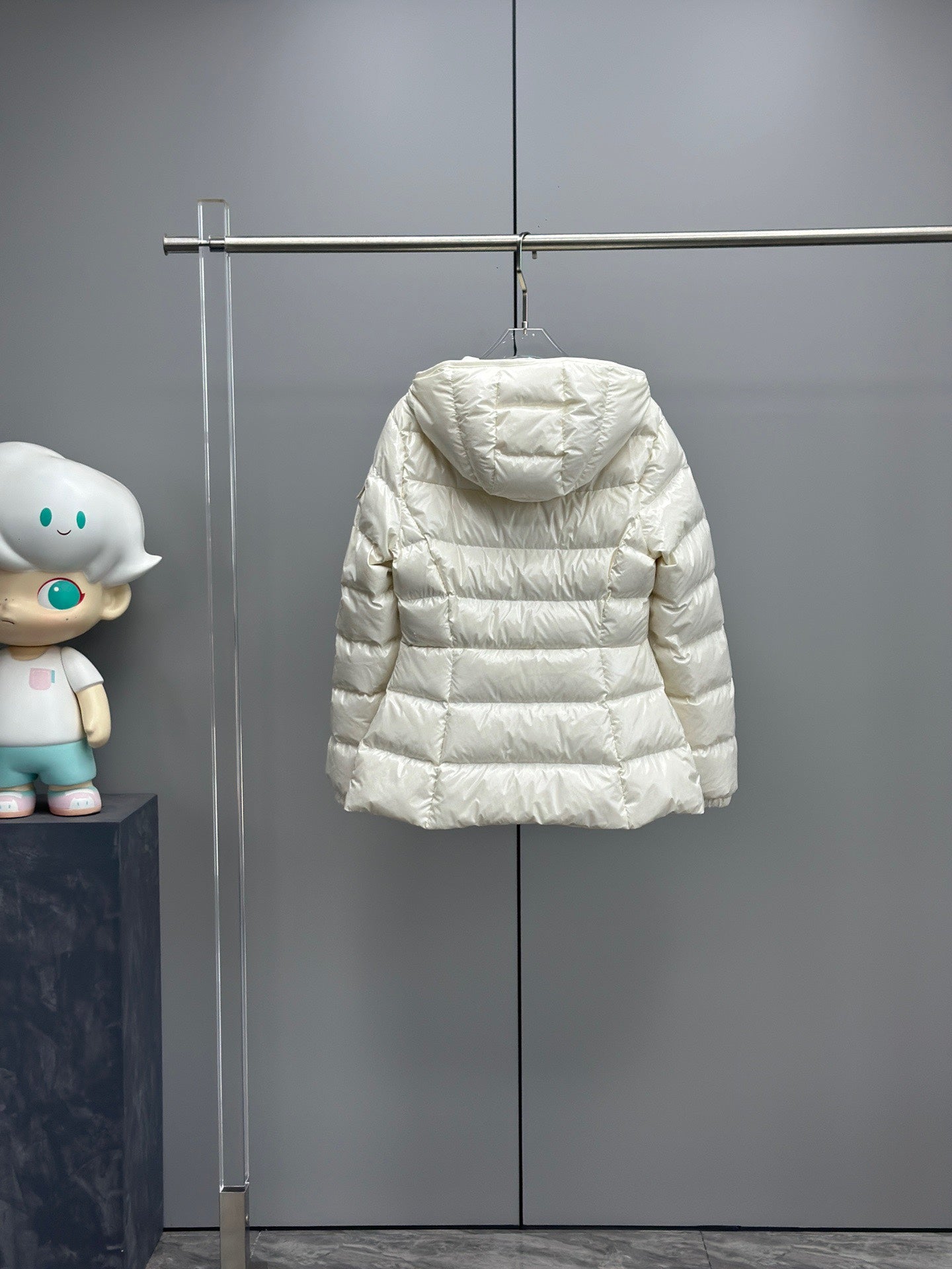 White long puffer jacket back view with hood and horizontal quilt stitching