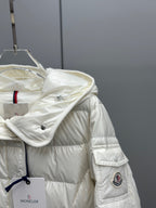 White puffer jacket with hood, raised collar, front buttons, sleeve patch detail