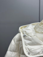 White puffer jacket hood with zipper, drawstring toggles, smooth nylon finish