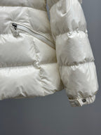 White quilted puffer jacket with diagonal zipper pocket, shiny fabric