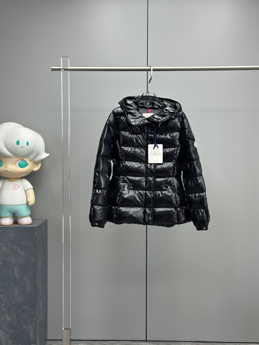 Black shiny puffer jacket with hood and front zip, kids style