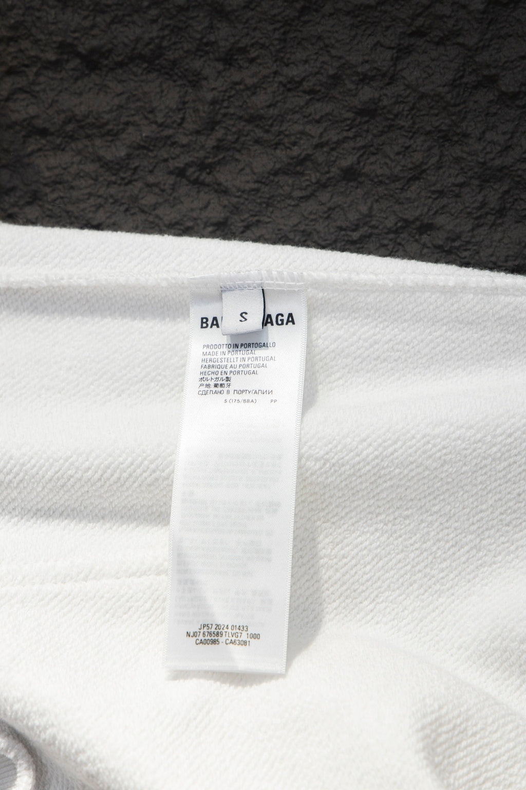Balenciaga white hoodie size label on fabric