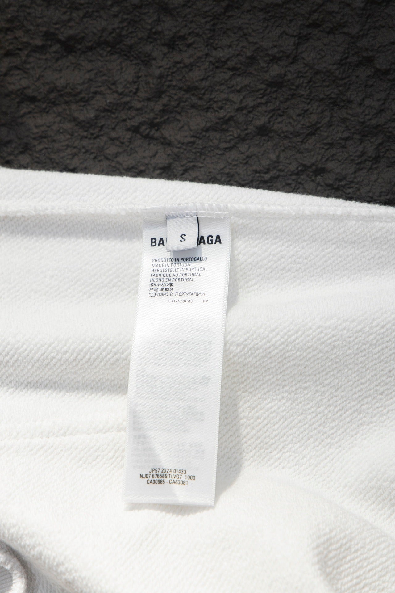 Balenciaga white hoodie size label on fabric