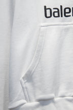 Balenciaga white zip-up hoodie pocket and stitched hem detail