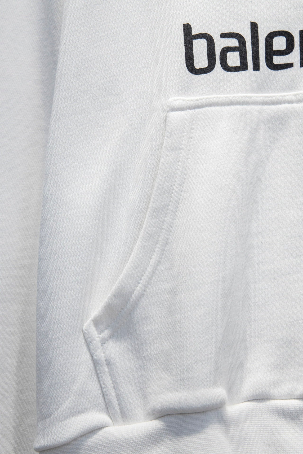 Balenciaga white zip-up hoodie pocket and stitched hem detail