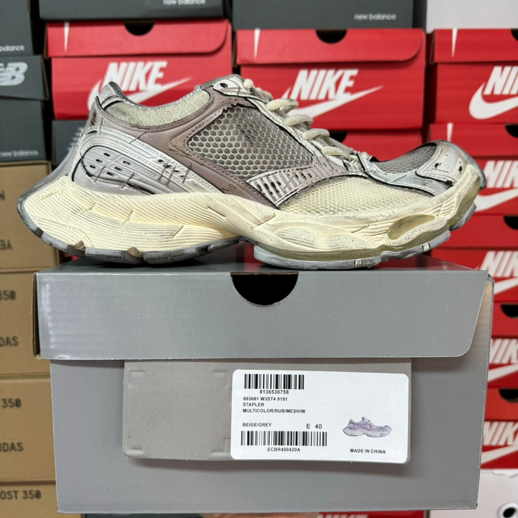 Unisex sneakers with grey textured panels and mesh upper, lace-up front and cream midsole