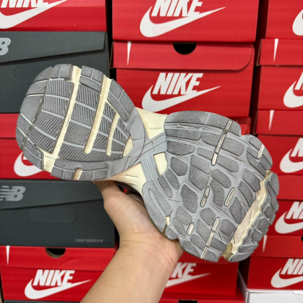 Unisex sneaker outsoles with grippy tread pattern and cream side cushioning