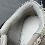 Metallic silver sneaker collar and inner lining with perforations