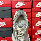 Unisex sneakers interior view with grey sockliner and lace-up opening