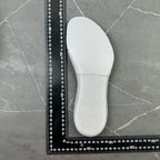 White sneaker insole, curved shape, subtle perforations