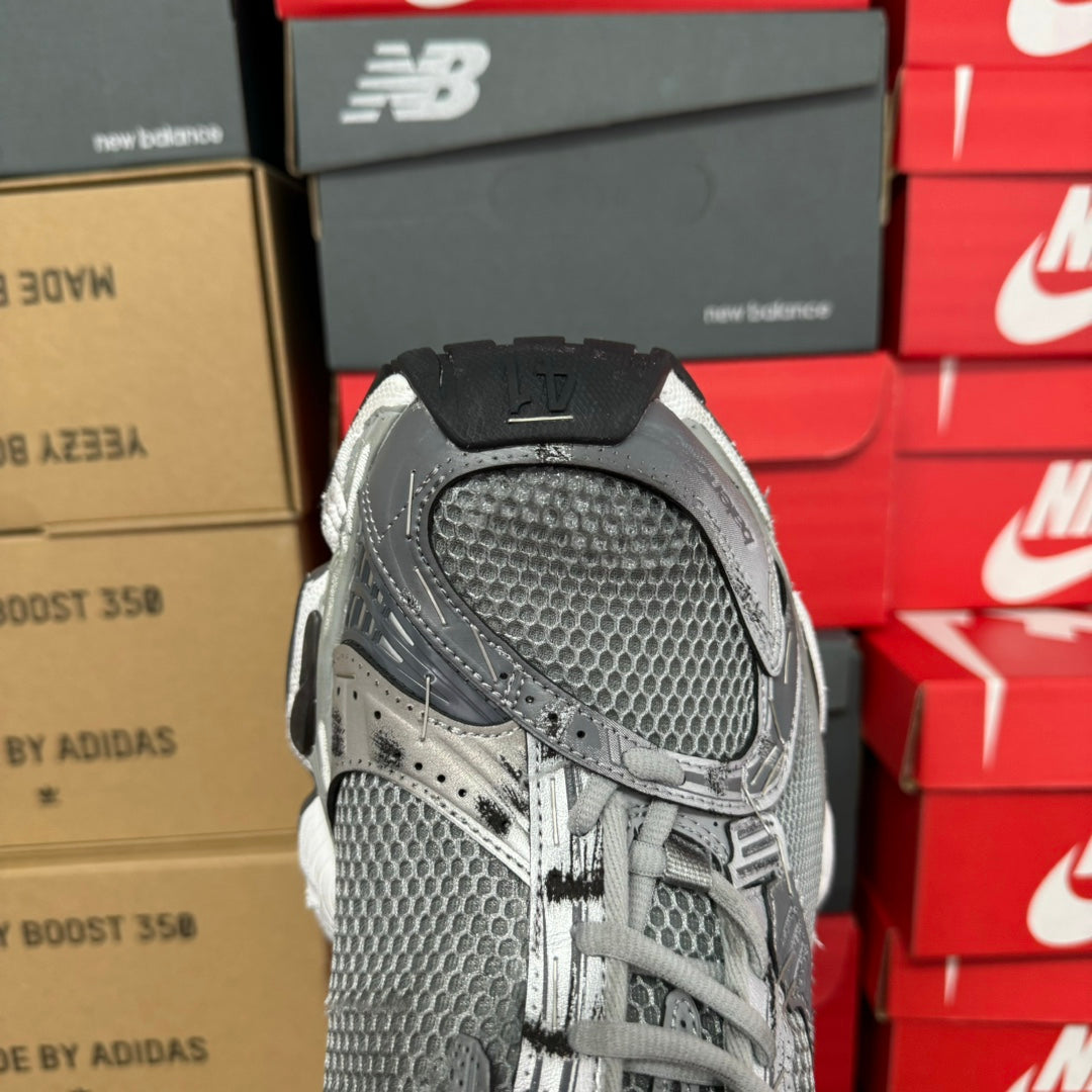 Balenciaga unisex sneakers with gray mesh upper and lace closure, close-up