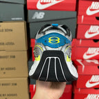 Unisex running shoe heel, black tread with blue and lime-yellow side details