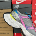 Unisex running shoe, gray mesh with pink upper, blue heel, and lime-yellow accents