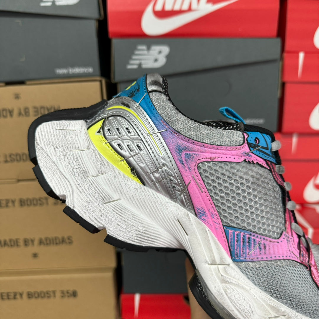 Unisex running shoe, gray mesh with pink upper, blue heel, and lime-yellow accents