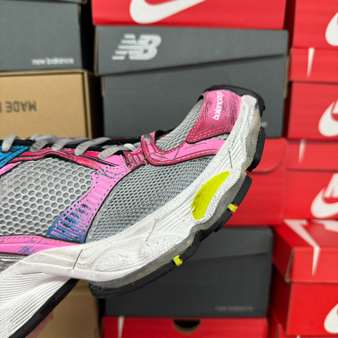 Unisex running shoe, pink and gray upper with blue laces and thick white sole