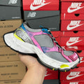 Unisex running shoe, gray mesh with pink and blue accents and thick white sole