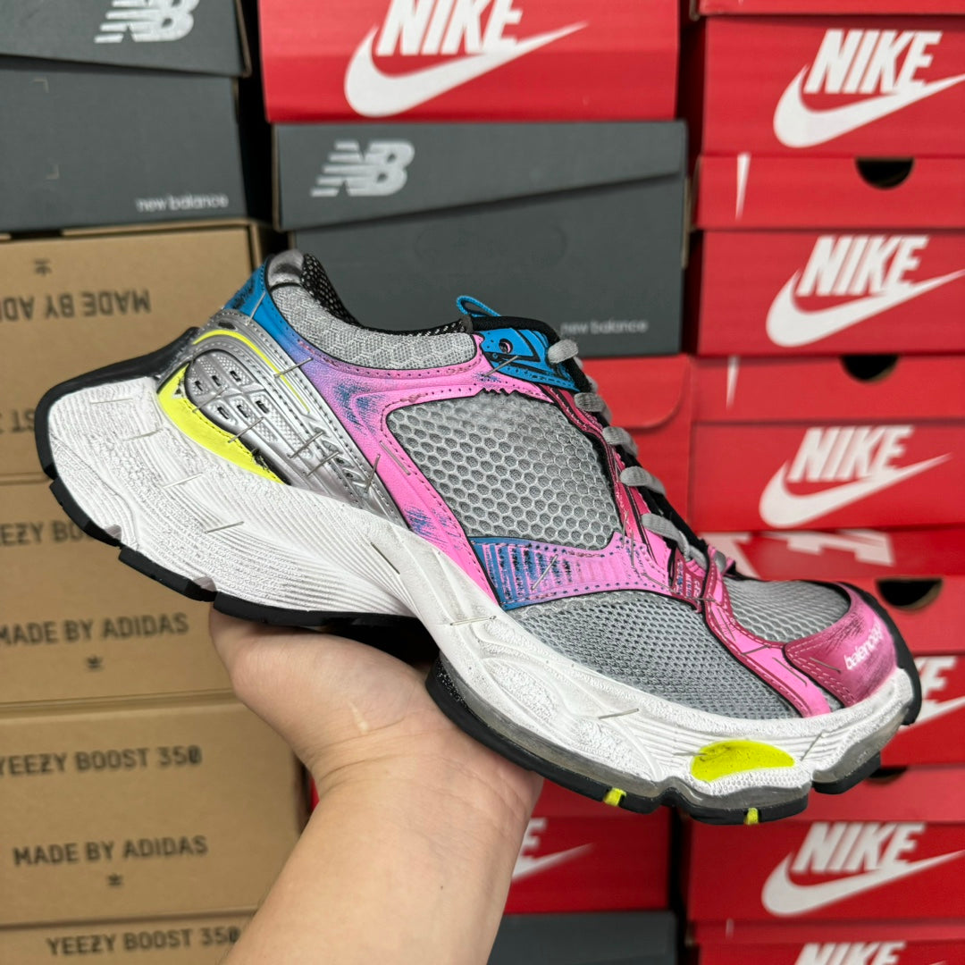 Unisex running shoe, gray mesh with pink and blue accents and thick white sole