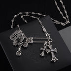 Silver-tone cross charm necklace with ornate cross pendant and rectangular tag charm