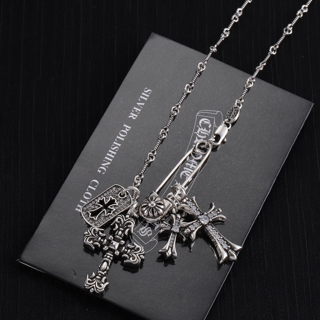 Silver-tone cross charm necklace with long cross pendant and tag-style charm