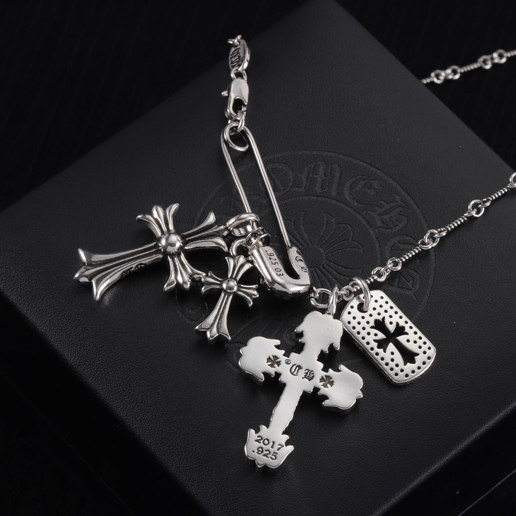 Silver-tone cross charm necklace with cross centerpiece and dog-tag style charms