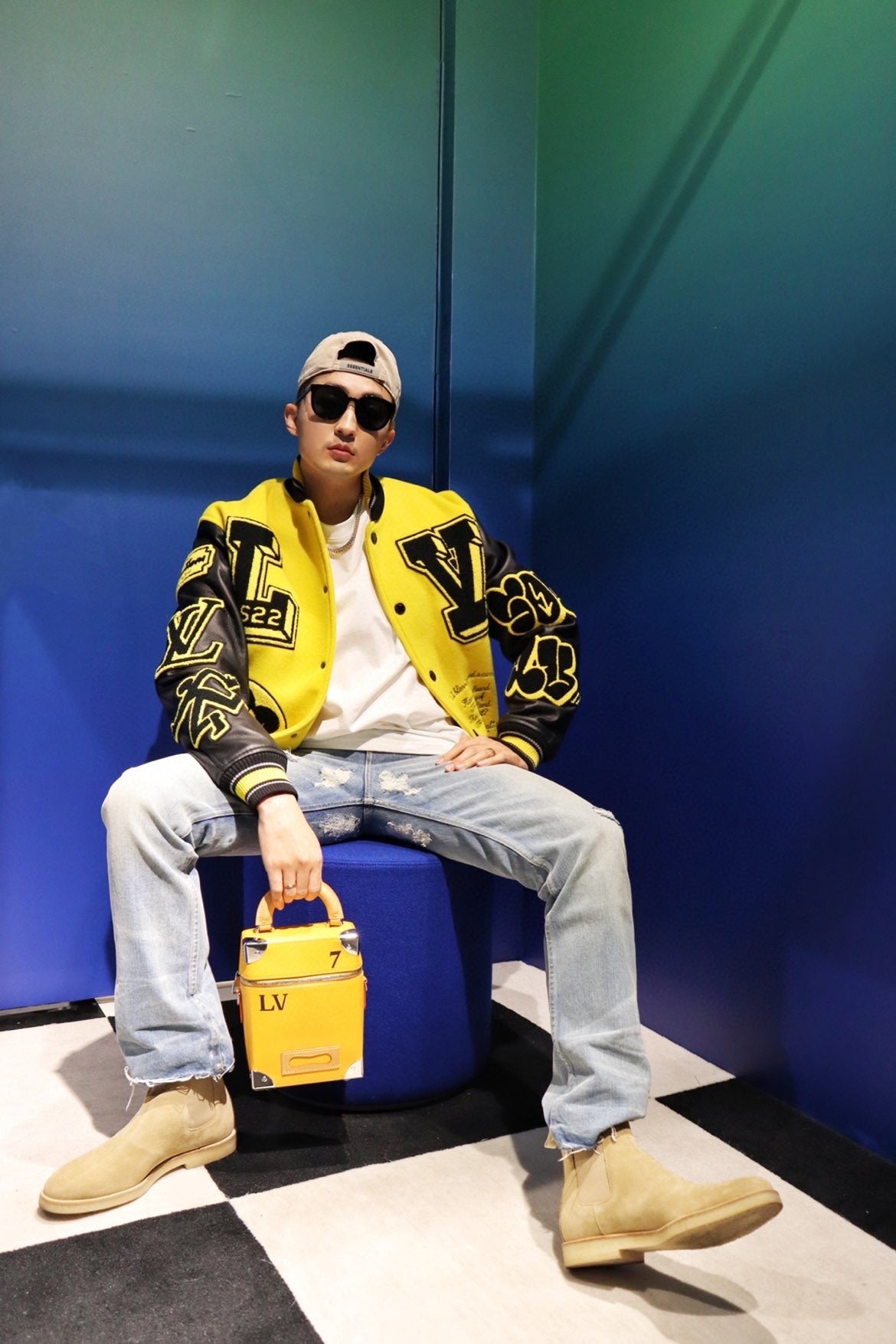 Louis Vuitton yellow varsity jacket with black trim and oversized logo patches