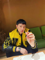 Louis Vuitton yellow and black varsity jacket with large LV-style graphic patches