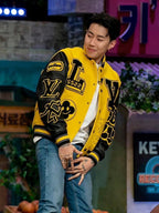 Louis Vuitton yellow varsity jacket with black collar and oversized graphic patches
