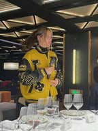 Louis Vuitton yellow varsity jacket with black varsity trim and logo patches
