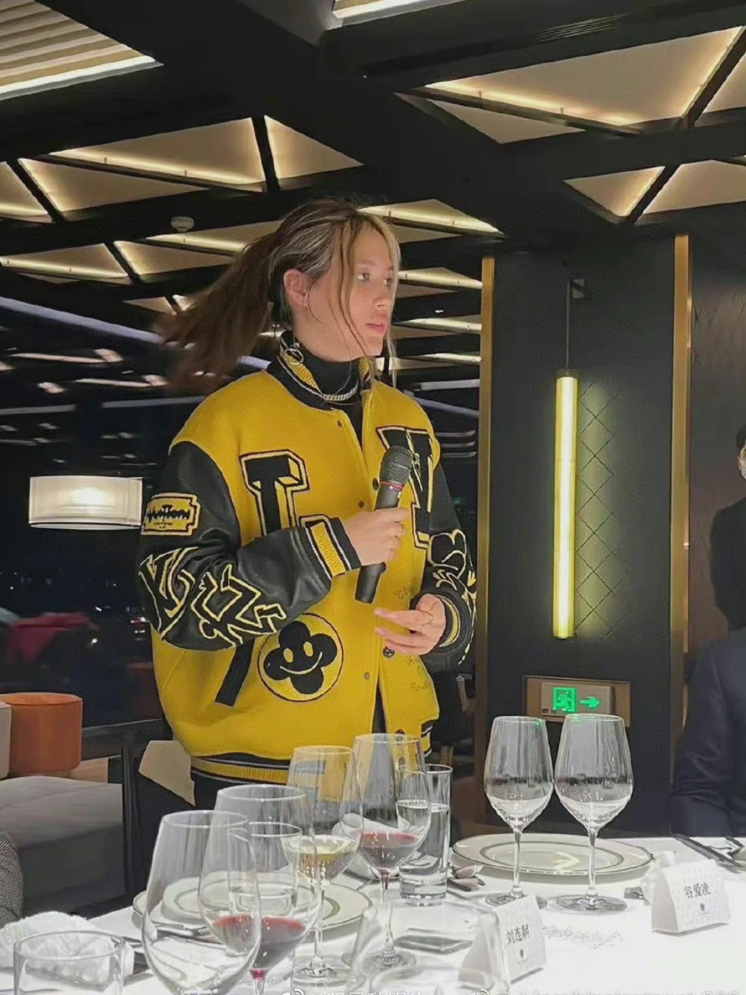 Louis Vuitton yellow varsity jacket with black varsity trim and logo patches