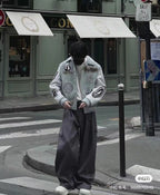 Light blue Louis Vuitton-style jacket with patch graphics and ribbed cuffs