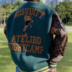 Green varsity jacket back view with large brown text and stripe trim at hem