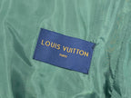 Louis Vuitton brand label on green garment fabric