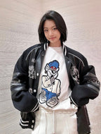 Louis Vuitton black varsity jacket with white striped cuffs and snap front