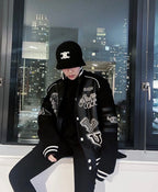 Louis Vuitton long varsity jacket, black with white striped cuffs and logo graphics