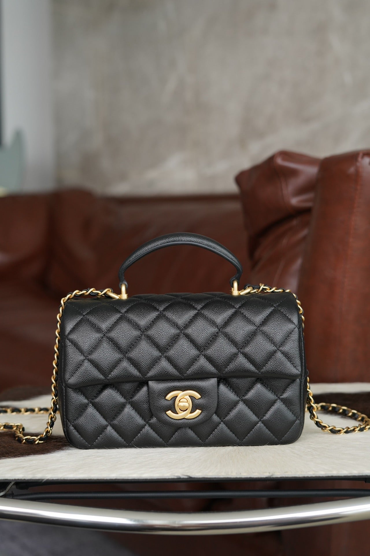 Chanel quilted black mini handbag with gold chain and CC clasp